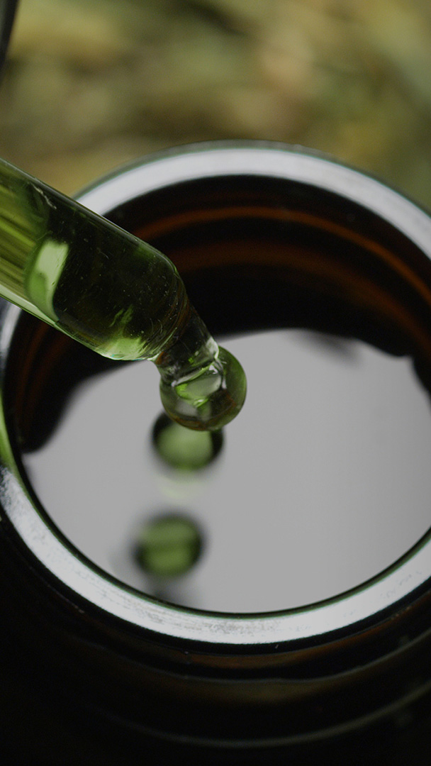 Close up a pipette extracts hemp oil